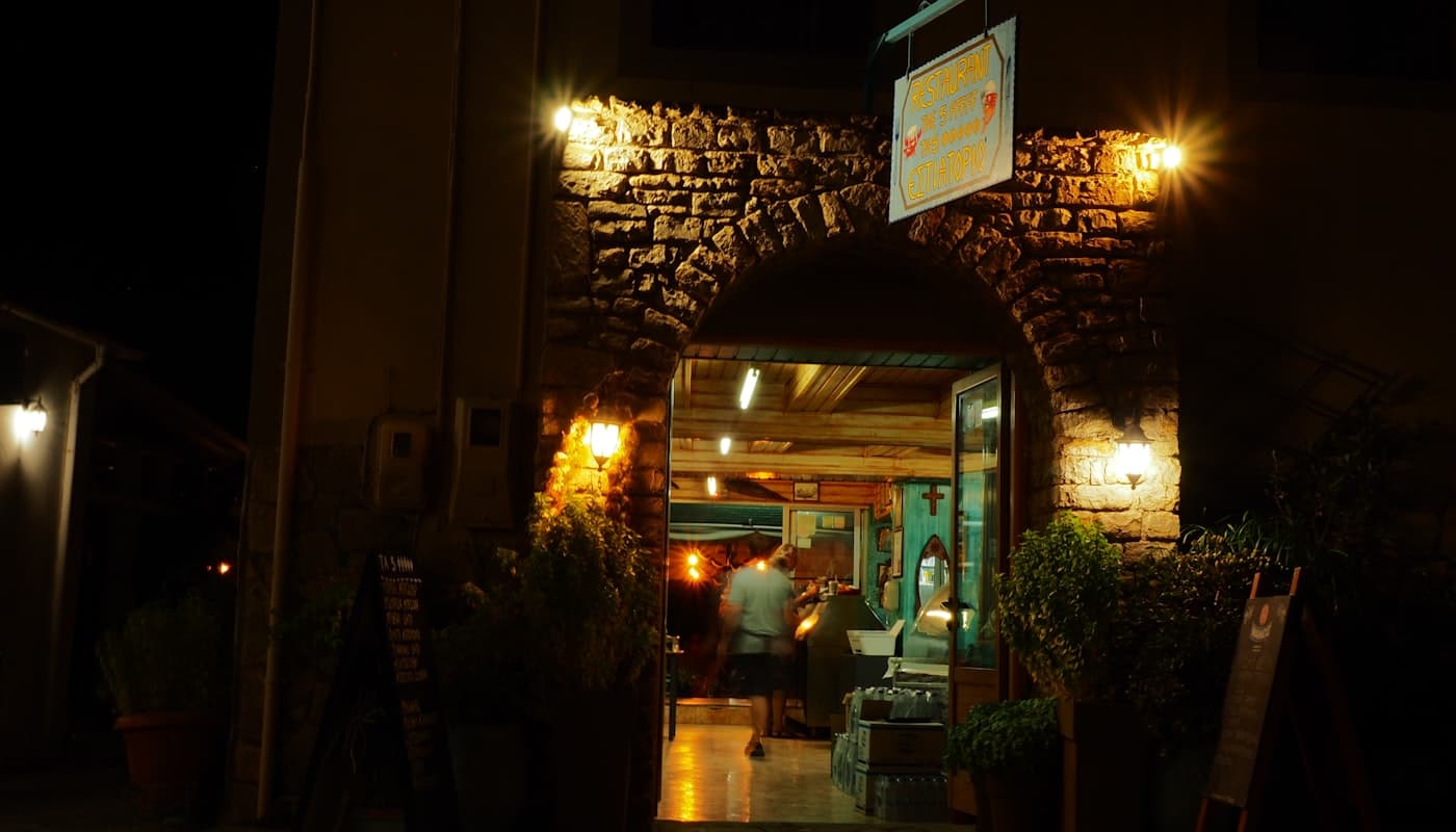 A warmly lit restaurant entrance at night — placeholder imagery standing in for Titan Brands Hospitality Group's restaurants